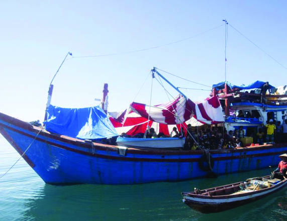 About 140 Rohingya Muslims on wooden boat off Indonesia’s coast as residents refuse to let them land